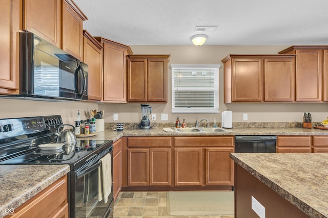 10731 Jimmy Lake Dr, Indianapolis, IN 46239 - kitchen with black appliances, a sink, brown cabinets, and light countertops