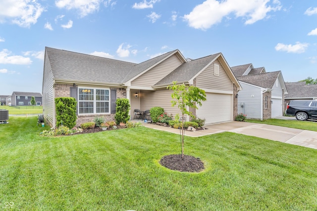 10731 Jimmy Lake Dr, Indianapolis, IN 46239 - view of front of home with brick siding, a garage, central AC unit, concrete driveway, and a front lawn