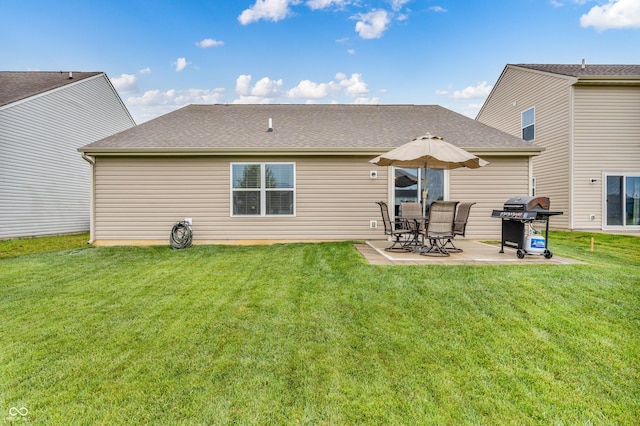 10731 Jimmy Lake Dr, Indianapolis, IN 46239 - rear view of house with a patio area, a lawn, and a shingled roof
