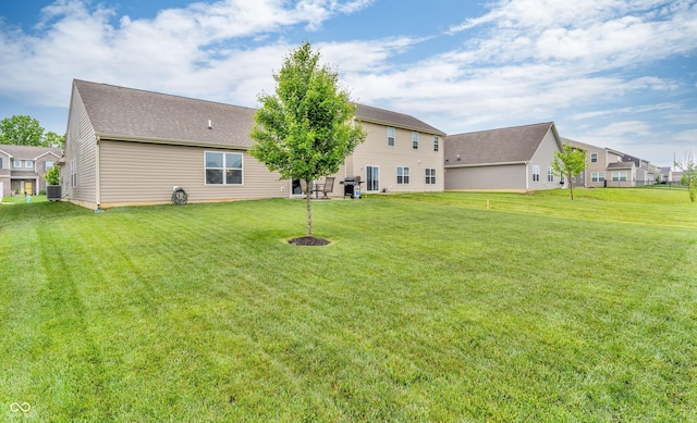 10731 Jimmy Lake Dr, Indianapolis, IN 46239 - rear view of property featuring a yard