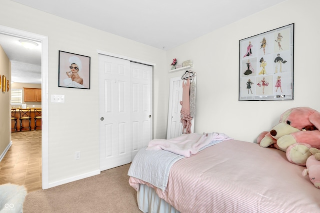 10731 Jimmy Lake Dr, Indianapolis, IN 46239 - bedroom with a closet, baseboards, and light carpet