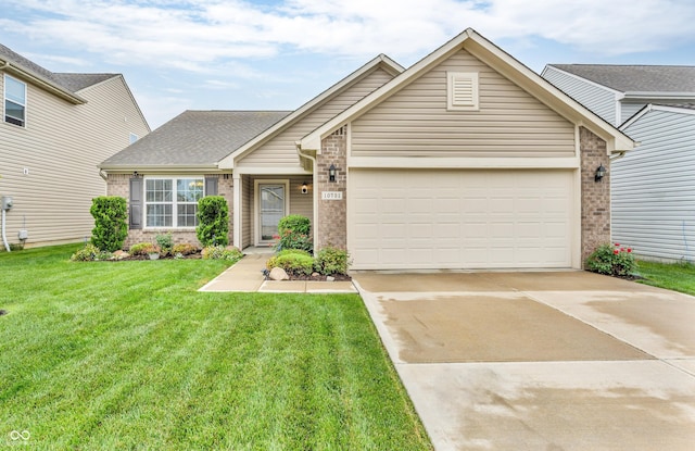 10731 Jimmy Lake Dr, Indianapolis, IN 46239 - view of front of property with brick siding, an attached garage, driveway, a front lawn, and roof with shingles