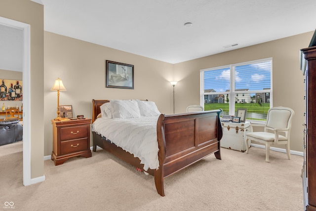 10731 Jimmy Lake Dr, Indianapolis, IN 46239 - bedroom featuring light carpet and baseboards