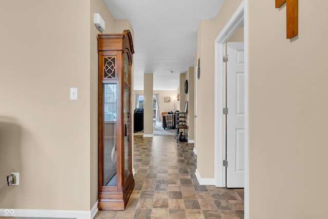 10731 Jimmy Lake Dr, Indianapolis, IN 46239 - corridor featuring stone finish flooring and baseboards