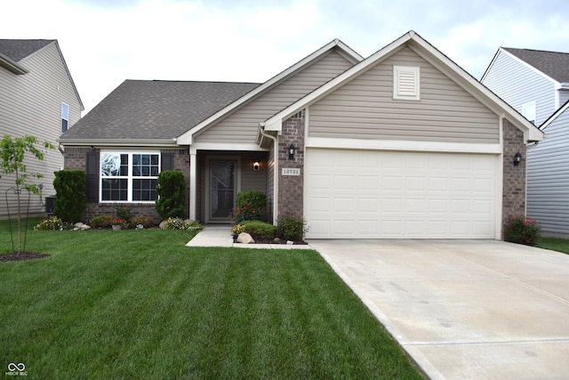 10731 Jimmy Lake Dr, Indianapolis, IN 46239 - view of front facade featuring brick siding, driveway, an attached garage, and a front lawn