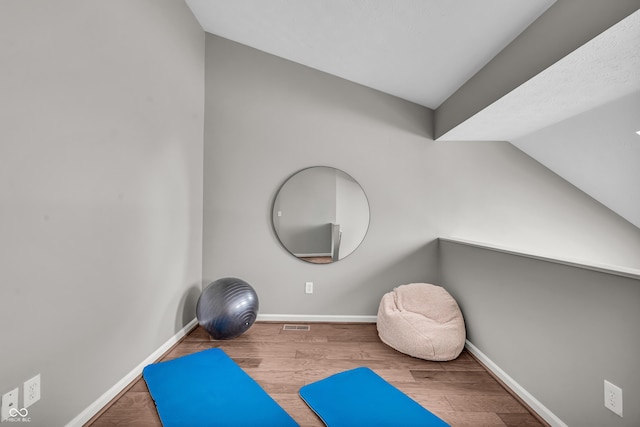 1064 Reserve Way, Indianapolis, IN 46220 - exercise area with baseboards, wood finished floors, and vaulted ceiling