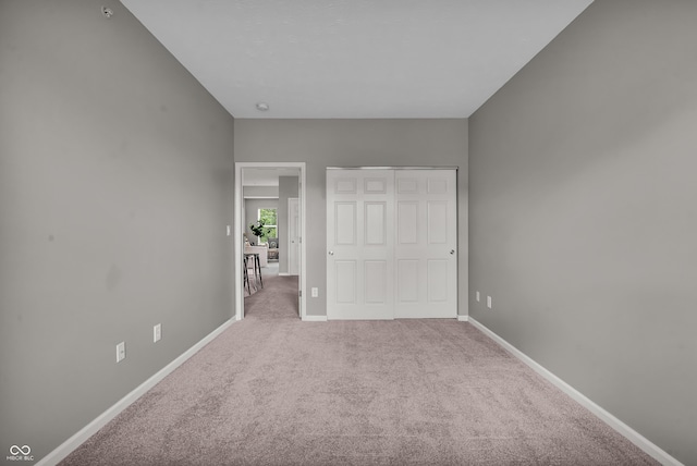 1064 Reserve Way, Indianapolis, IN 46220 - unfurnished bedroom with carpet, a closet, and baseboards