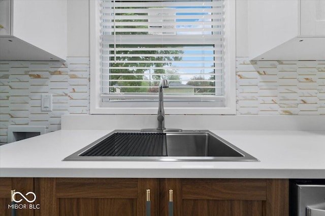 450 Historic Pleasant St, Noblesville, IN 46060 - kitchen view of a sink, light countertops, and backsplash