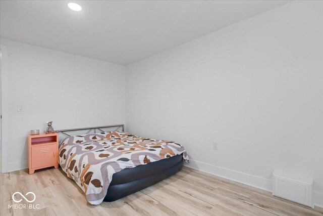 450 Historic Pleasant St, Noblesville, IN 46060 - bedroom with light wood-style flooring and baseboards