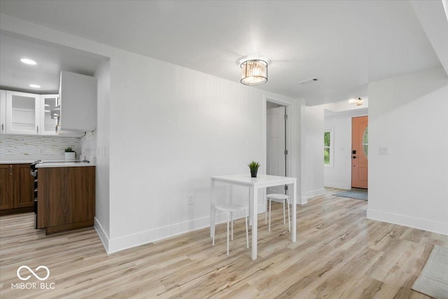 450 Historic Pleasant St, Noblesville, IN 46060 - dining area featuring light wood finished floors, baseboards, and recessed lighting