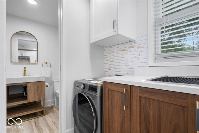 450 Historic Pleasant St, Noblesville, IN 46060 - laundry area with washer / clothes dryer and light wood-style flooring