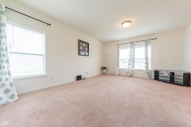 4712 Clairmont Dr, Columbus, IN 47203 - unfurnished room featuring healthy amount of natural light, carpet flooring, and baseboards