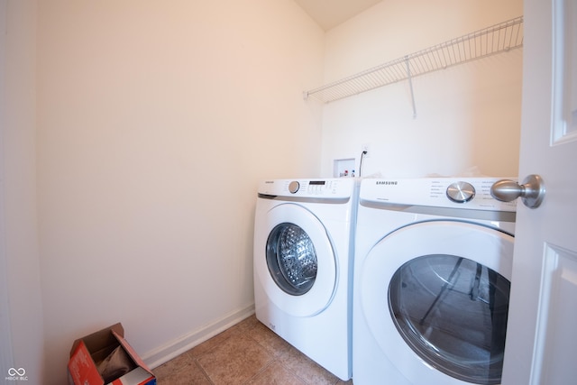 4712 Clairmont Dr, Columbus, IN 47203 - laundry area featuring washer and dryer, baseboards, and tile patterned floors