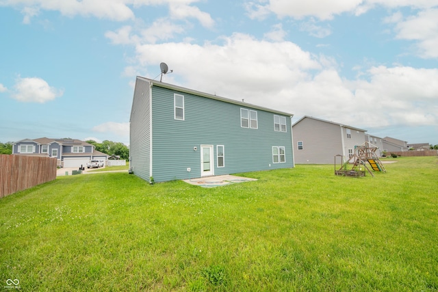 4712 Clairmont Dr, Columbus, IN 47203 - back of property featuring a playground and a patio area