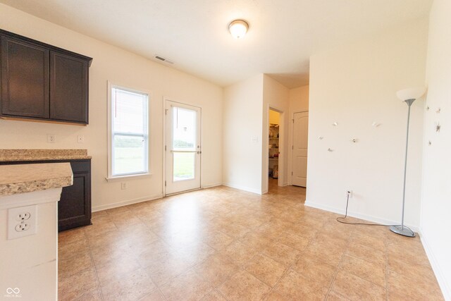 4712 Clairmont Dr, Columbus, IN 47203 - unfurnished living room with baseboards