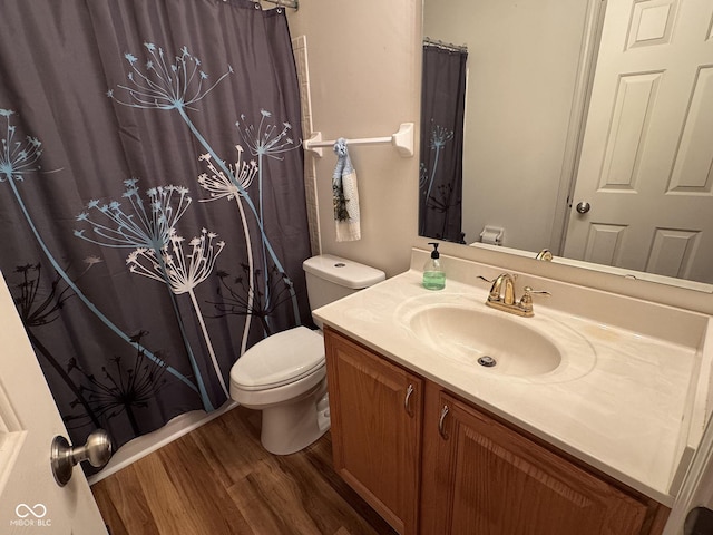 7970 Cobblesprings Dr, Avon, IN 46123 - bathroom with wood finished floors, toilet, vanity, and curtained shower