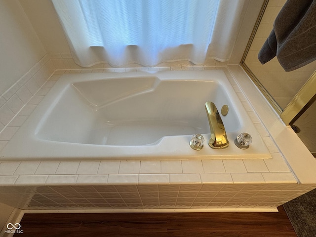 7970 Cobblesprings Dr, Avon, IN 46123 - bathroom view of a bath and wood finished floors