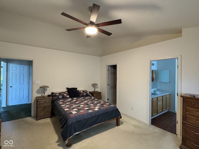7970 Cobblesprings Dr, Avon, IN 46123 - bedroom featuring carpet, vaulted ceiling, a sink, connected bathroom, and baseboards
