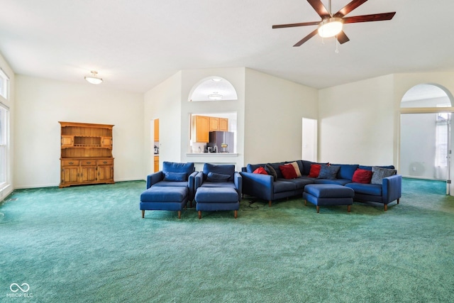 7970 Cobblesprings Dr, Avon, IN 46123 - living area featuring carpet, a ceiling fan, arched walkways, and baseboards