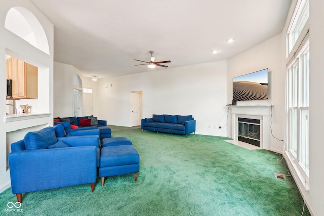 7970 Cobblesprings Dr, Avon, IN 46123 - living room with a fireplace with flush hearth, carpet flooring, and a ceiling fan