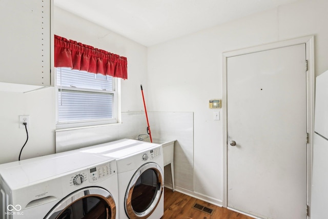 7970 Cobblesprings Dr, Avon, IN 46123 - laundry room with wood finished floors and separate washer and dryer