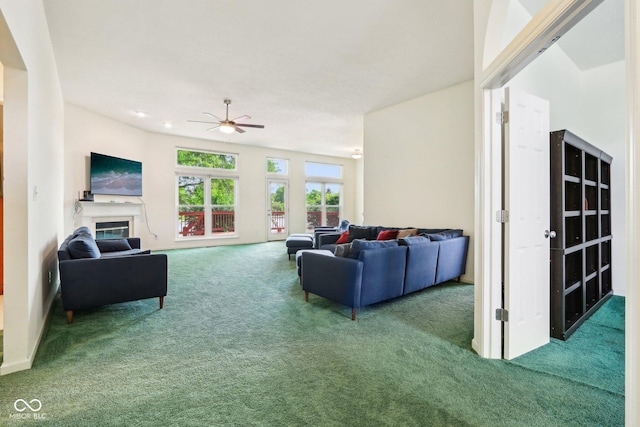 7970 Cobblesprings Dr, Avon, IN 46123 - living room with carpet floors, ceiling fan, and a glass covered fireplace