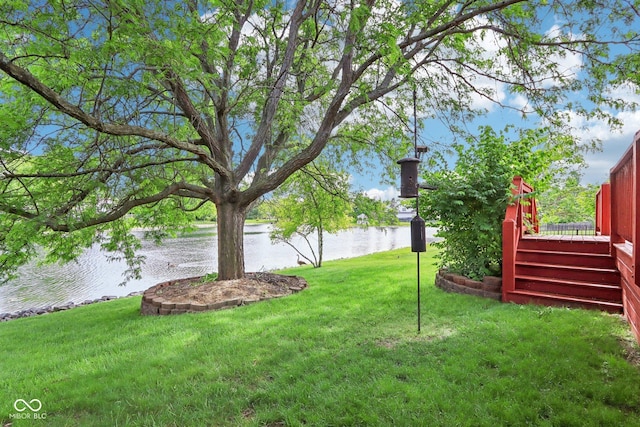 7970 Cobblesprings Dr, Avon, IN 46123 - view of green lawn with a deck with water view