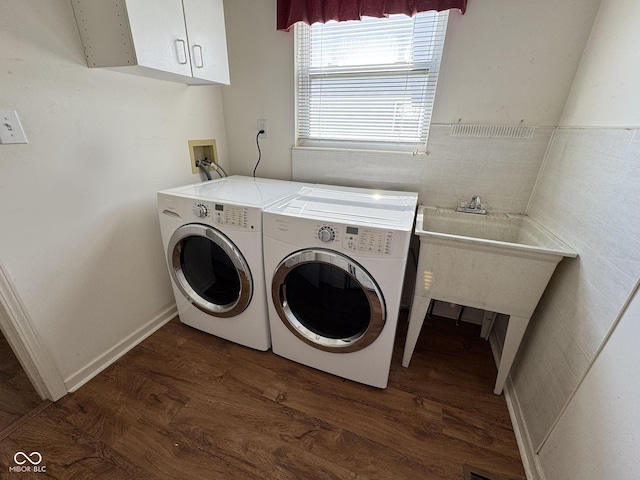 7970 Cobblesprings Dr, Avon, IN 46123 - washroom with dark wood finished floors, washing machine and clothes dryer, cabinet space, and tile walls