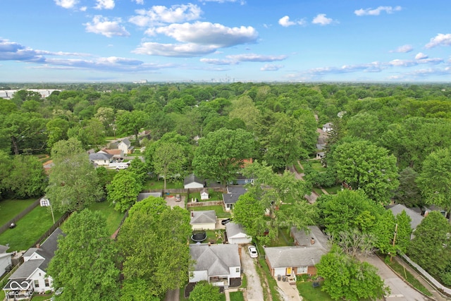 aerial perspective of suburban area with a heavily wooded area
