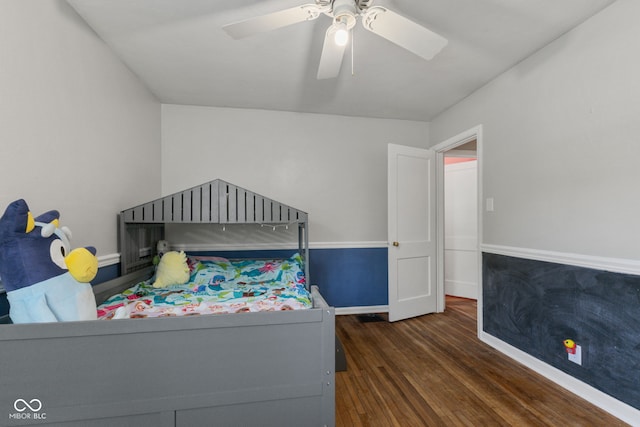 bedroom with wood finished floors, baseboards, and a ceiling fan
