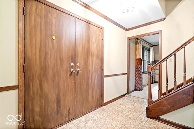 659 Carson Ct, Carmel, IN 46033 - entryway featuring crown molding, baseboards, and stairway