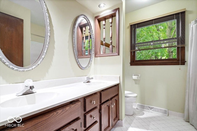 659 Carson Ct, Carmel, IN 46033 - full bath with toilet, double vanity, baseboards, and tile patterned flooring