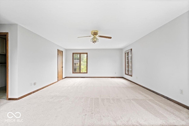 659 Carson Ct, Carmel, IN 46033 - empty room featuring a ceiling fan, light colored carpet, and baseboards