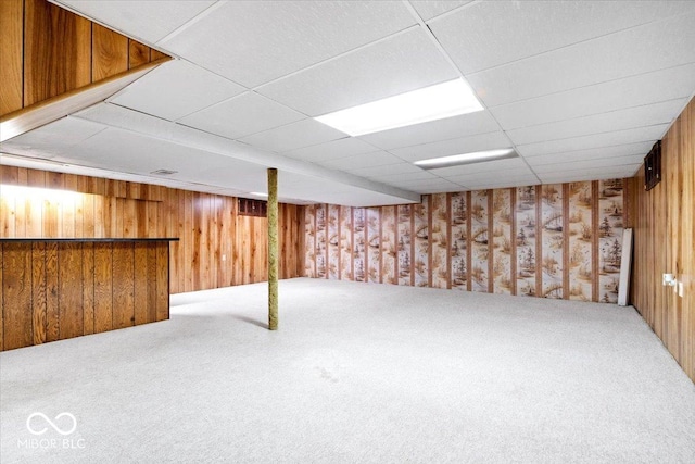 659 Carson Ct, Carmel, IN 46033 - finished below grade area with carpet, wood walls, and a paneled ceiling