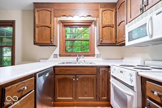 659 Carson Ct, Carmel, IN 46033 - kitchen with white appliances, a sink, light countertops, and healthy amount of natural light
