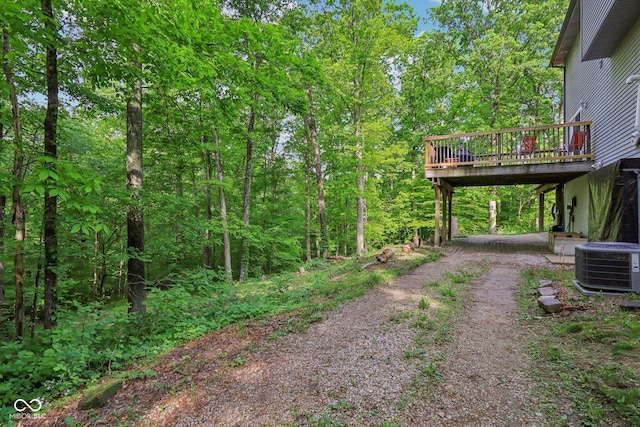 6804 Erika Ln, Nashville, IN 47448 - view of yard with driveway, central AC unit, and a wooden deck
