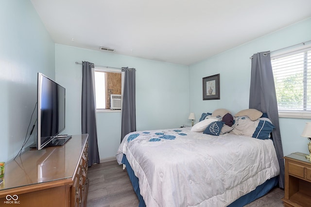 4967 Diana Dr, Indianapolis, IN 46203 - bedroom featuring multiple windows and wood finished floors
