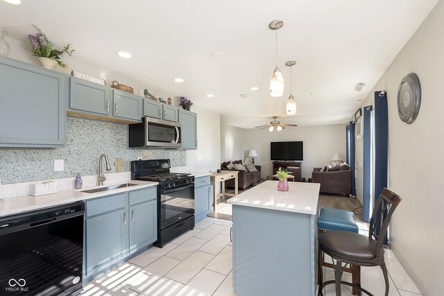 4967 Diana Dr, Indianapolis, IN 46203 - kitchen featuring black appliances, a sink, a kitchen island, tasteful backsplash, and ceiling fan