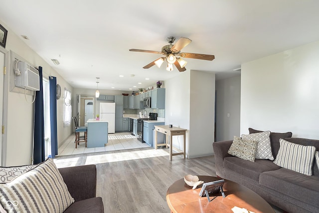 4967 Diana Dr, Indianapolis, IN 46203 - living area with a wall mounted air conditioner, light wood-style flooring, a ceiling fan, baseboards, and recessed lighting