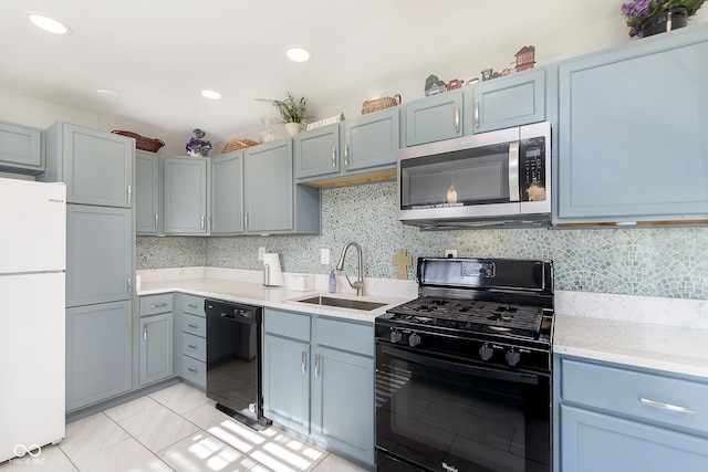 4967 Diana Dr, Indianapolis, IN 46203 - kitchen with black appliances, a sink, light countertops, recessed lighting, and tasteful backsplash