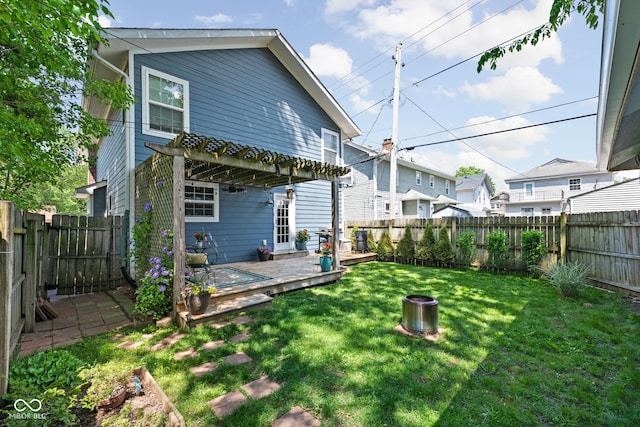 609 E 39th St, Indianapolis, IN 46205 - back of property featuring a wooden deck, a pergola, and a fenced backyard
