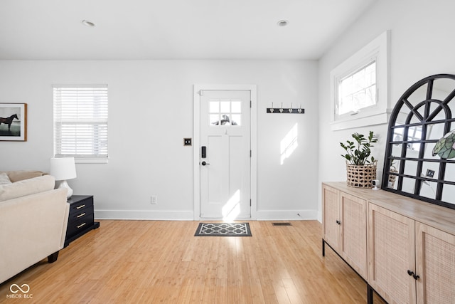 609 E 39th St, Indianapolis, IN 46205 - foyer featuring light wood finished floors and baseboards
