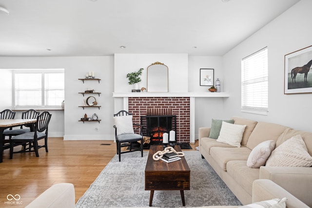 609 E 39th St, Indianapolis, IN 46205 - living room with light wood-style floors and a fireplace