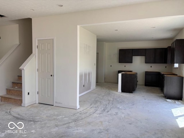 3897 Berkdale Ct, Columbus, IN 47203 - unfurnished living room with stairs