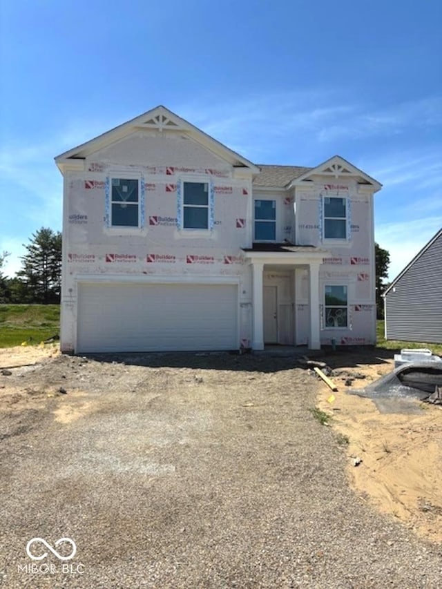 3897 Berkdale Ct, Columbus, IN 47203 - unfinished property with a garage and dirt driveway