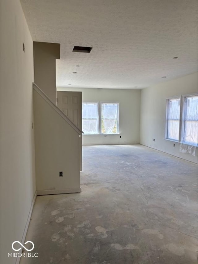 3897 Berkdale Ct, Columbus, IN 47203 - unfurnished room with a textured ceiling and baseboards