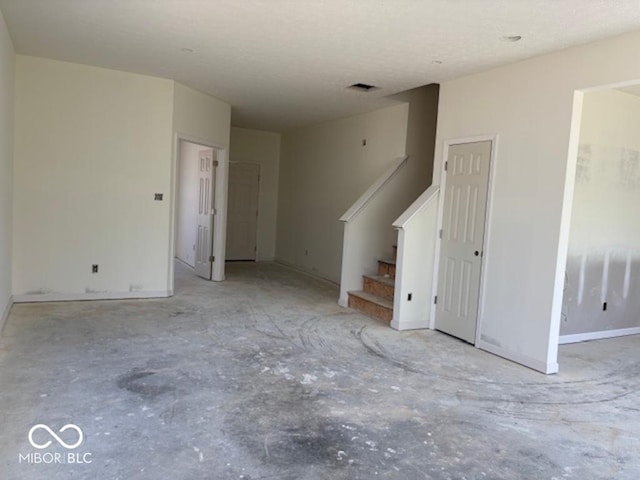 3897 Berkdale Ct, Columbus, IN 47203 - unfurnished living room with stairway