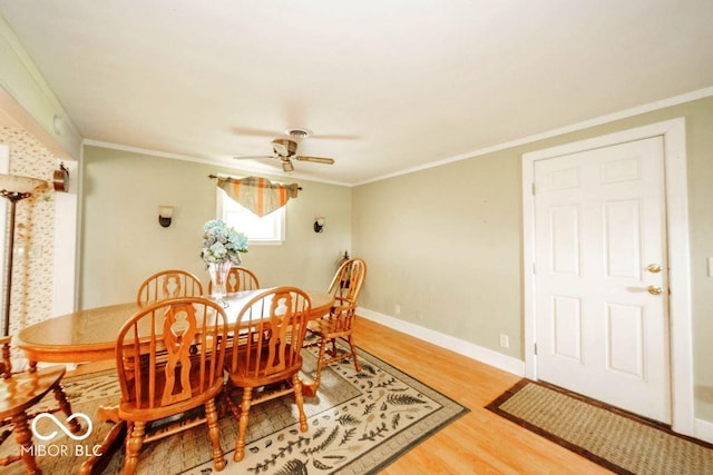 17310 N Willman Rd, Eaton, IN 47338 - dining room with light wood-style flooring, ornamental molding, a ceiling fan, and baseboards