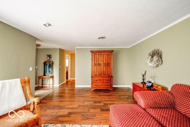 17310 N Willman Rd, Eaton, IN 47338 - sitting room with dark wood finished floors, crown molding, baseboards, and a textured ceiling