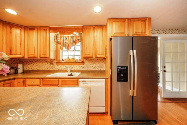 17310 N Willman Rd, Eaton, IN 47338 - kitchen featuring stainless steel fridge with ice dispenser, white dishwasher, a sink, light wood finished floors, and backsplash